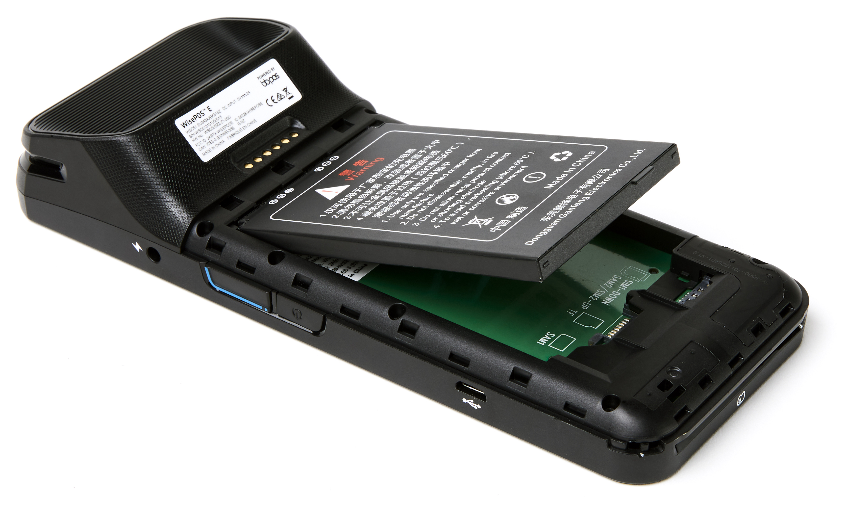 Illustration of the WisePOS e. The back panel has been removed and a battery pack is shown being inserted.
